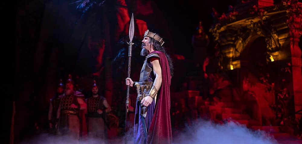 Actor dressed as a king in full costume on stage at Sight and Sound Theatres Branson
