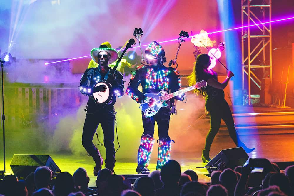 LED-costumed performers with guitars on stage at a Branson variety show