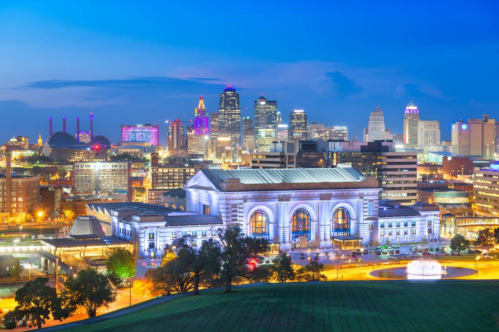 Kansas City skyline at dusk with Union Station in the foreground, starting point of the I-49 to I-44 to US-65 route to Branson