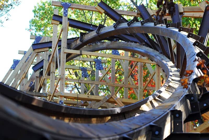 Outlaw Run wooden roller coaster at Silver Dollar City in Branson Missouri with fall foliage in the background