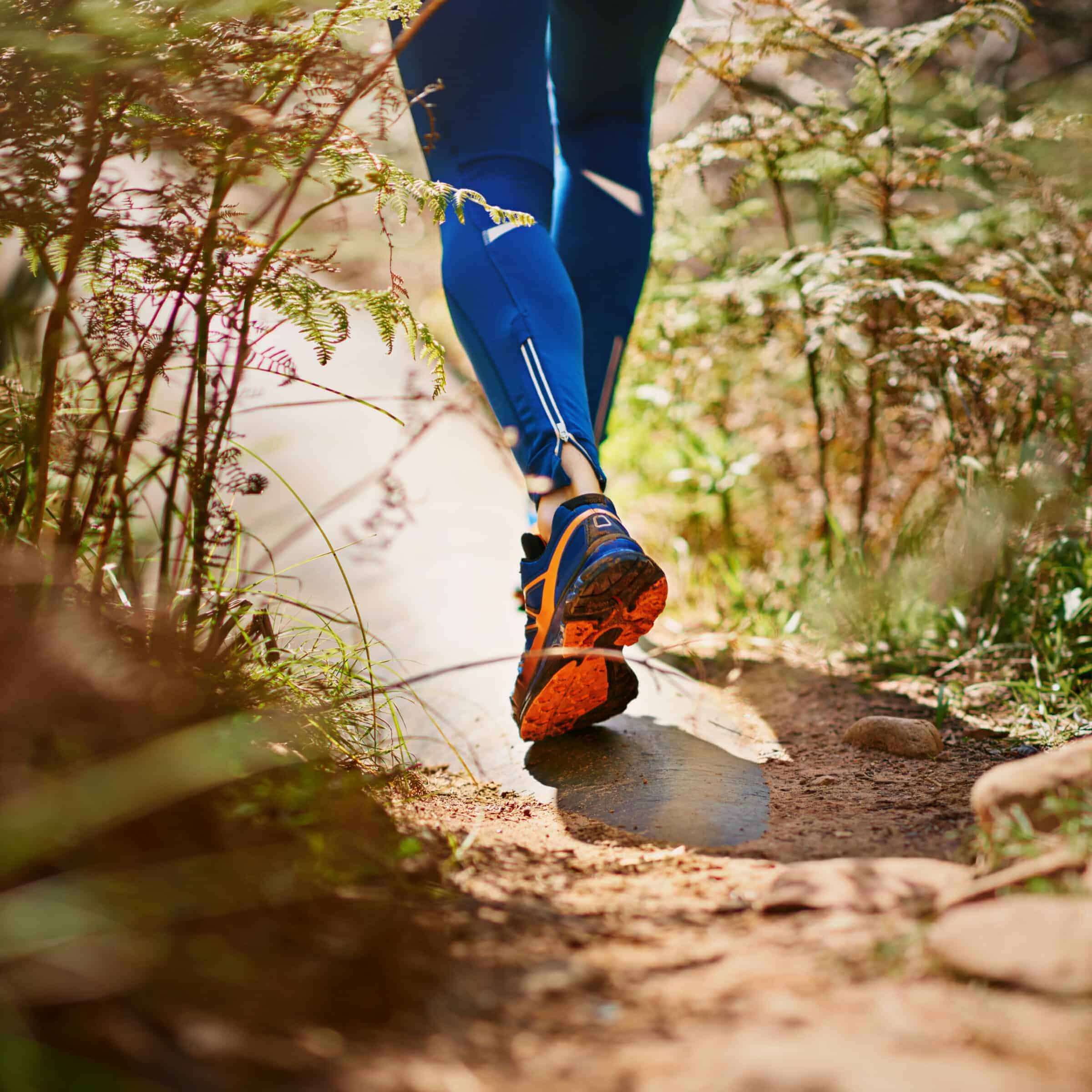 Hiker on a wooded trail in the Ozarks representing the Rally Point Branson 2026 Sunrise Hike and Ruck on Saturday June 13