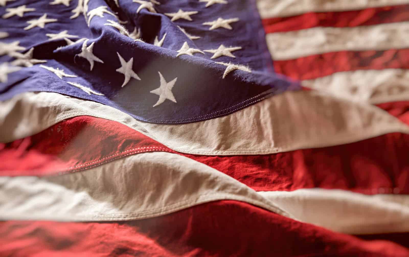 Close-up of a cotton United States flag showing the stars and stripes